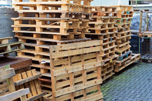 Low-emission van parked outside a London transfer station for materials delivery